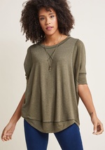 This heather green top is always number one on your list of wardrobe staples! Complete with a high-low hem and a relaxed, dolman-sleeved silhouette, this soft, French Terry shirt provides the foundation for countless stylish ensembles. by Ft-892