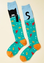 There's never any wondering what's on your style menu, because you're always serving up a fresh look - like these aqua socks, for example! Utterly adorable, these knee highs boast a hungry black cat, red and orange fish, and a generous helping of quirk th by 