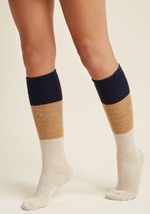 Cool temps and snow-capped landscapes beware - these colorblock socks are here, they&rsquo;re fierce, and with their cozy knit fabric, they&rsquo;re bringin&rsquo; the heat! Mottled navy, gold, and tan hues give these knee-highs a varsity vibe, with a fun by MK1503