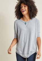 This heather grey top is always number one on your list of wardrobe staples! Complete with a high-low hem and a relaxed, dolman-sleeved silhouette, this soft, French Terry shirt provides the foundation for countless stylish ensembles. by Ft-892