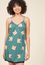 As evening draws near, you have a choice to make - head out, or slip into these comfy cat pajamas? Reviewing the muted blue-green hue, black lace trimmings, and orange kitty visages of this ModCloth-exclusive, cami-and-boyshorts set, you decide that quirk by 