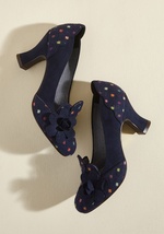 Unique elements abound on these navy pumps by Ruby Shoo, leaving your craving for unexpected style totally satisfied! Faux-suede, tapered heels support the loafer-inspired silhouette of these super-chic kicks, which offer dotted toes and counters, fun flo by Lola