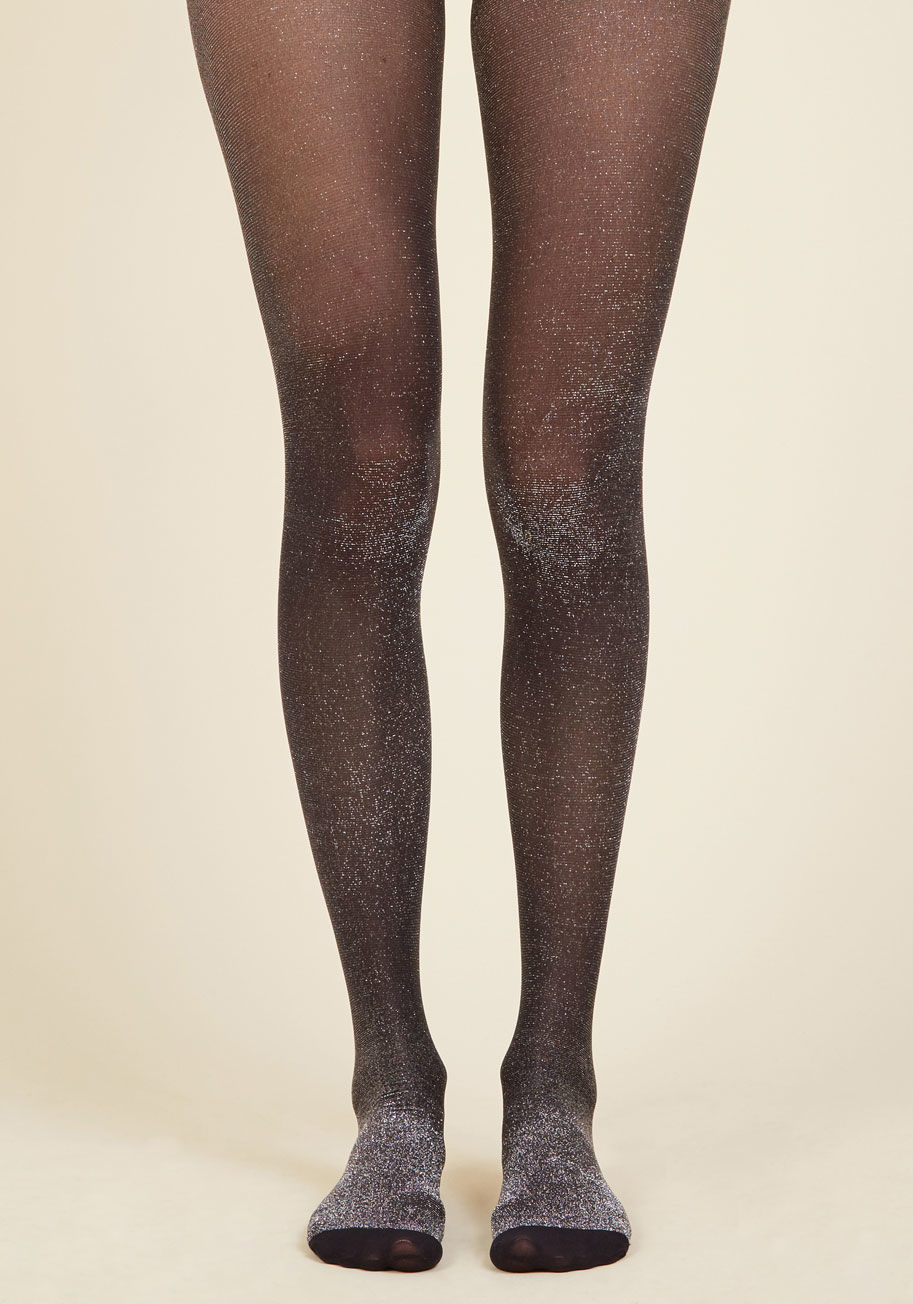  - After meeting your absolute favorite DJ - and scoring a compliment on these sheer black tights, of course - you brace yourself for a life-changing show. With silver sparkles threaded throughout, these tights are the bass drop of your ensemble, showing you