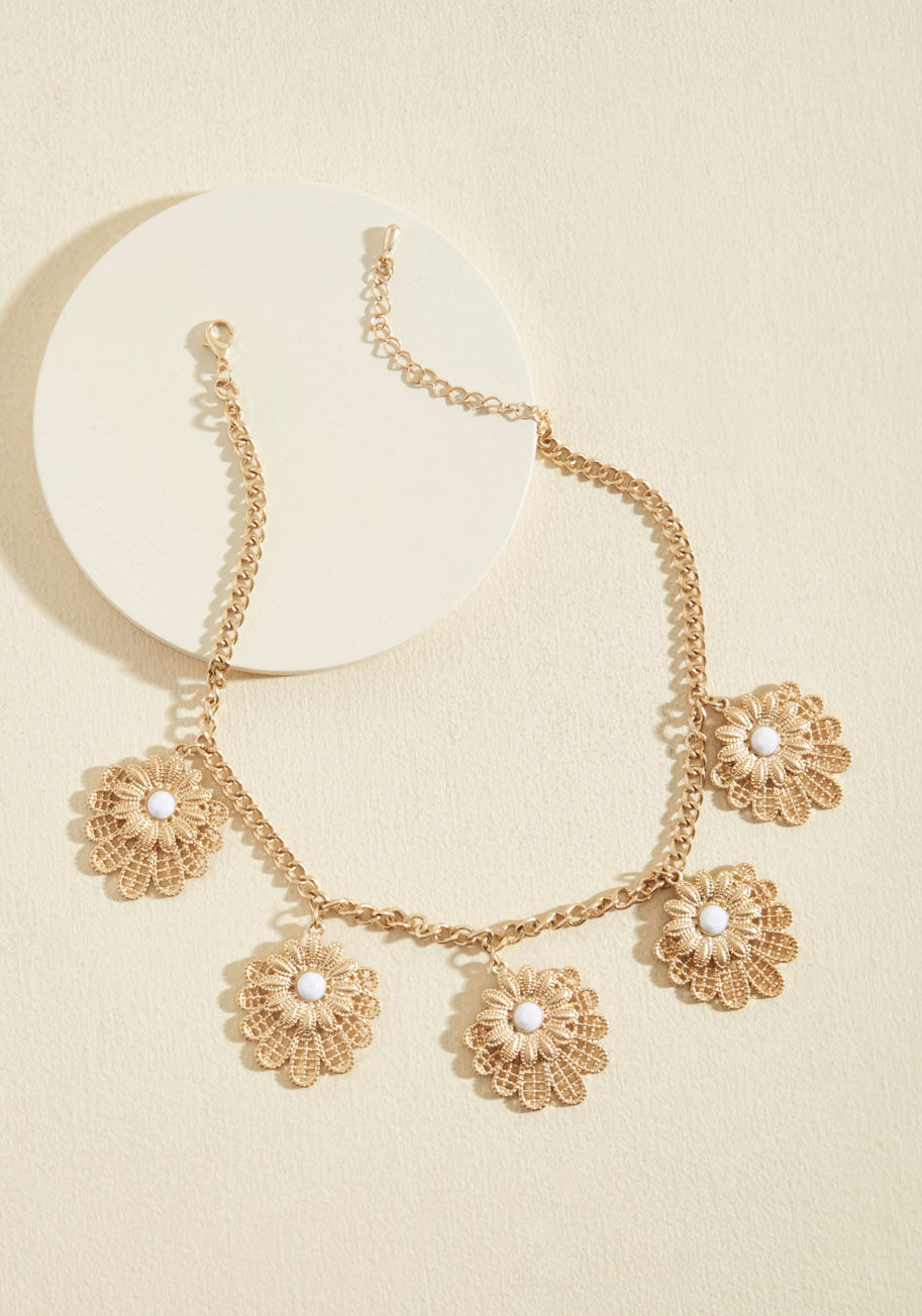  - By adding this gold necklace to your accessories collection, you ensure that a touch of serenity is always on offer! Five floral-detailed pendants touched with white rhinestone centers give this precious piece a lighthearted look, reminding you to enjoy e