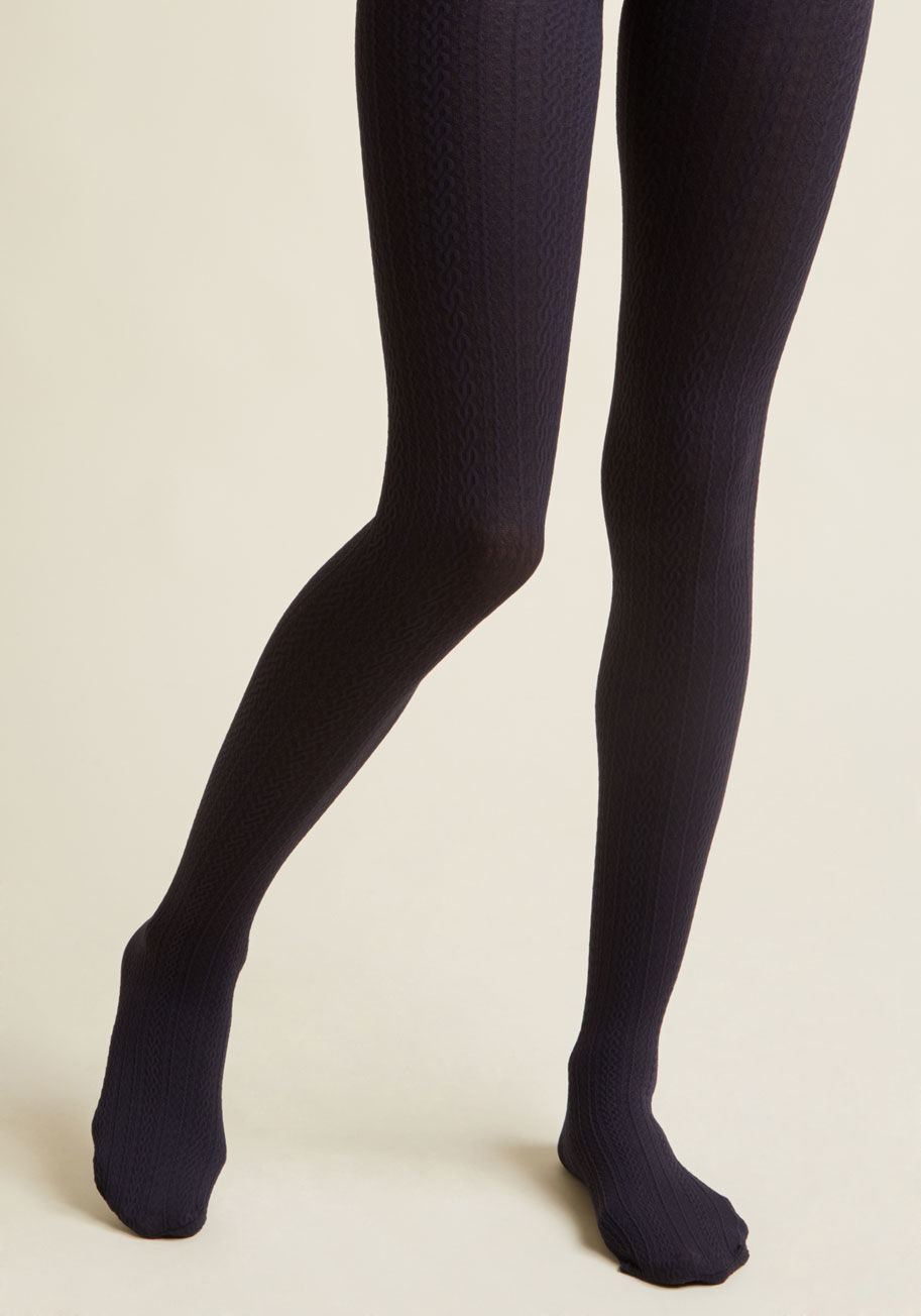  - Delay praising these black tights? Surely you jest! From the moment you don the cable-knit texturing of this chic hosiery, commendation for your style choice will echo throughout the rafters, and you can bet we&rsquo;ll have joined right