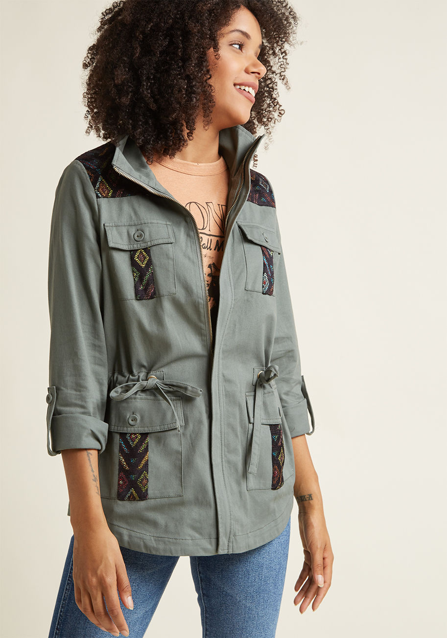  - Don&rsquo;t judge it on a first glance - there is more than meets the eye to this olive jacket! Part of our ModCloth namesake label, this spiffy anorak boasts a drawstring-cinched waist, plentiful pockets, and a strikingly colorful pattern to its woven tr