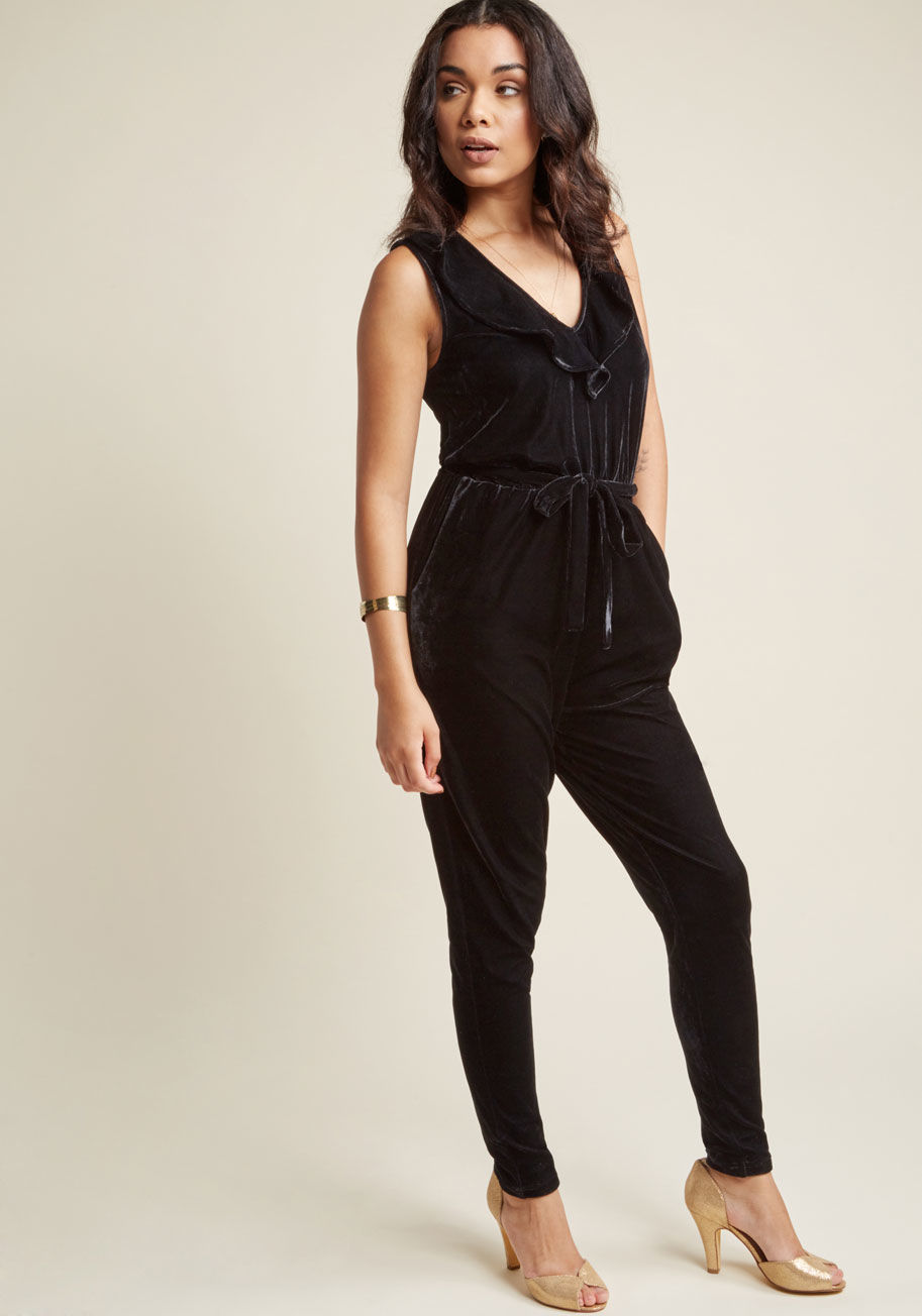  - Don't slip into this black velvet jumpsuit until you're sure you're ready for all the attention that's comin' your way! Designed with a deep, ruffled V-neckline, a self sash, secret pockets, and a straight-leg silhouette, this ModCloth namesake label piec