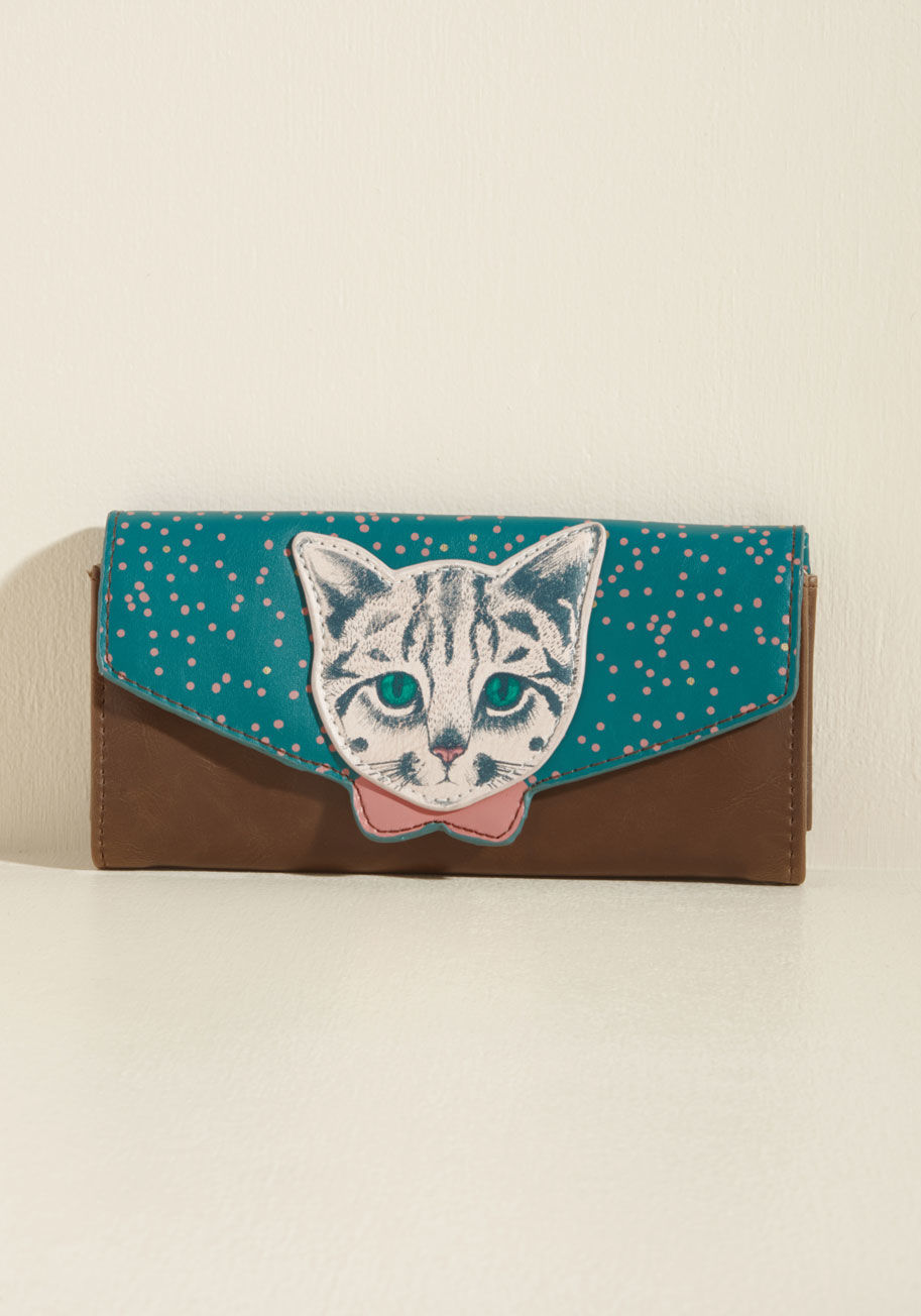  - Expect this cat-printed wallet to go unnoticed? Surely you jest! This faux-leather accessory from Disaster Designs commands attention with its teal and chocolate brown palette, quirky closure, and dotted interior. 'Meow' about that!