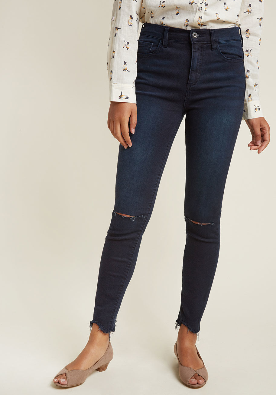  - Fearlessness is your middle name, which you make known while boldly rockin' these dark wash skinny jeans! The plentiful pockets, distressed knees, and frayed hems of these stretch-touched wonders make you proud to put your raddest self out there.