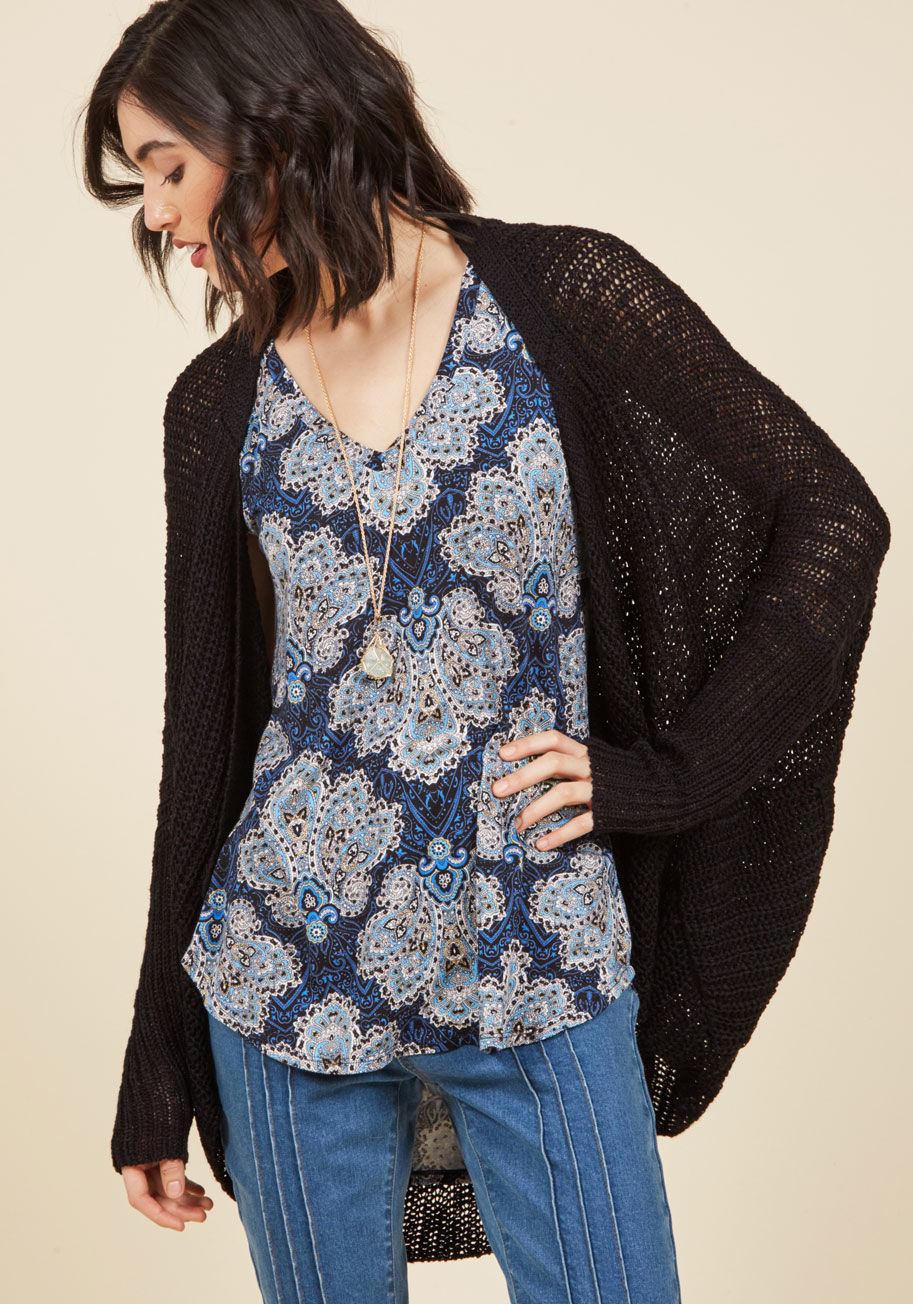  - Flaunting this black cardigan means good vibes and chill times are guaranteed to follow! A pair of handy pockets, long dolman sleeves, and a cocoon-style silhouette characterize this open-knit number, putting an easygoing spin on anyplace you end up.