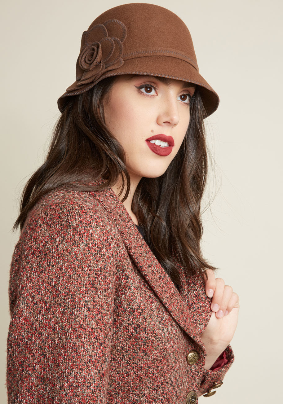  - In an effort to keep retro style close at hand, you always have this brown wool cloche hanging by your door! That way, it's easy to grab this hat on your way out the door, and flaunt its grey stitching 'n' flower applique on the reg.