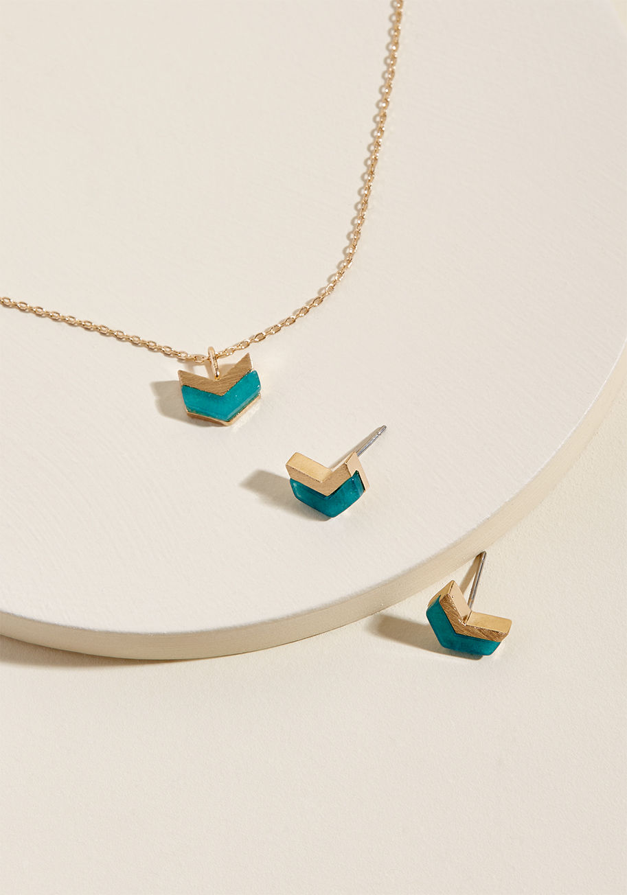  - In the pretty peppering of polish this necklace and earring set provides, you'll feel primed and ready to handle whatever the day throws your way! The teal-and-gold chevron motif atop the pendant and each stud of this adornment duo makes a thoughtful stat