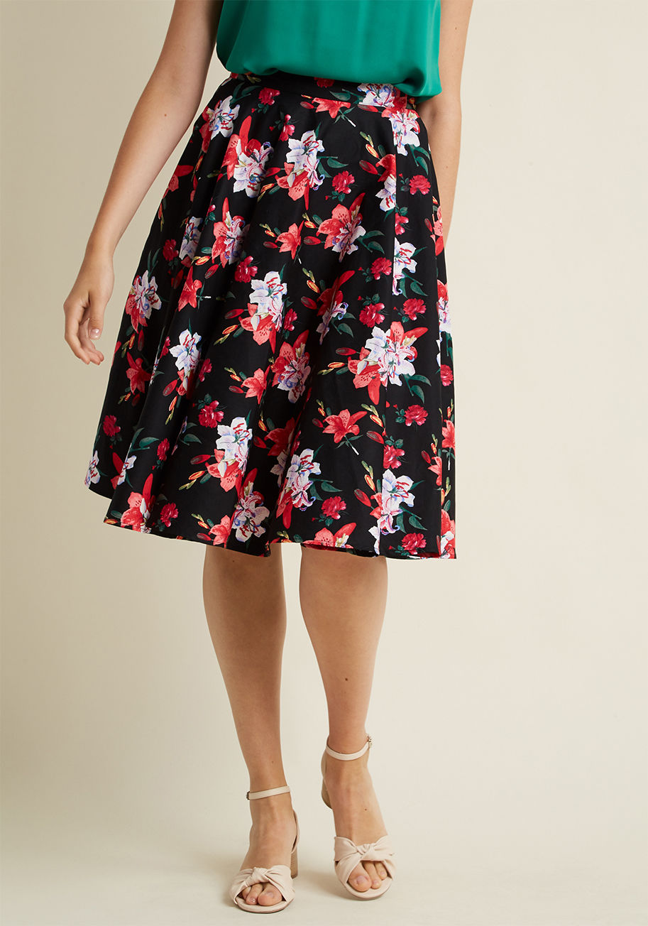  - In the rare moments you're not flaunting this black midi skirt, you know you can employ it the second a situation calls for polish! Between its high waist, hidden pockets, comfortable cotton fabric, and fab floral print, this Hell Bunny bottom is the obvi