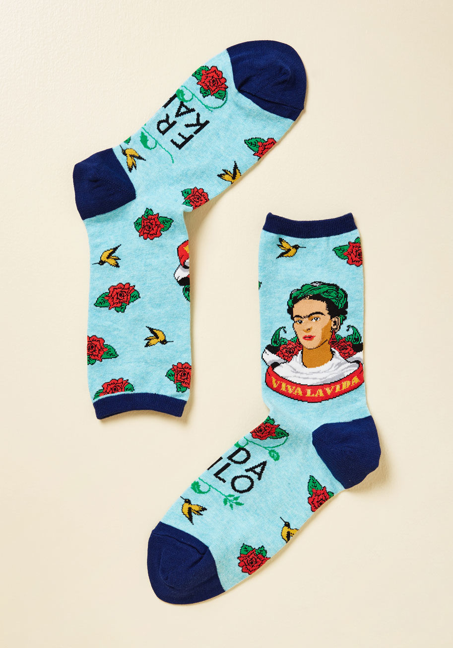  - In these light blue crew socks, you are the picture of artful relaxation! Touting navy trim, a sprinkling of red flowers 'n' yellow hummingbirds, and a portrait of your favorite artist alongside a Viva la Vida banner, this footwear nods to legendary lovel