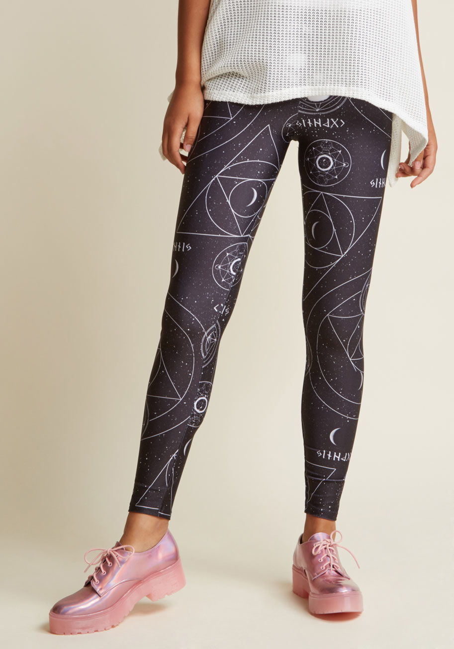  - It won't be long before word of you rocking these black leggings spreads across the galaxy! A purposefully buzzworthy print of skulls, moons, stars, geometric shapes, and other mysterious elements pop against the silky fabric of this pair