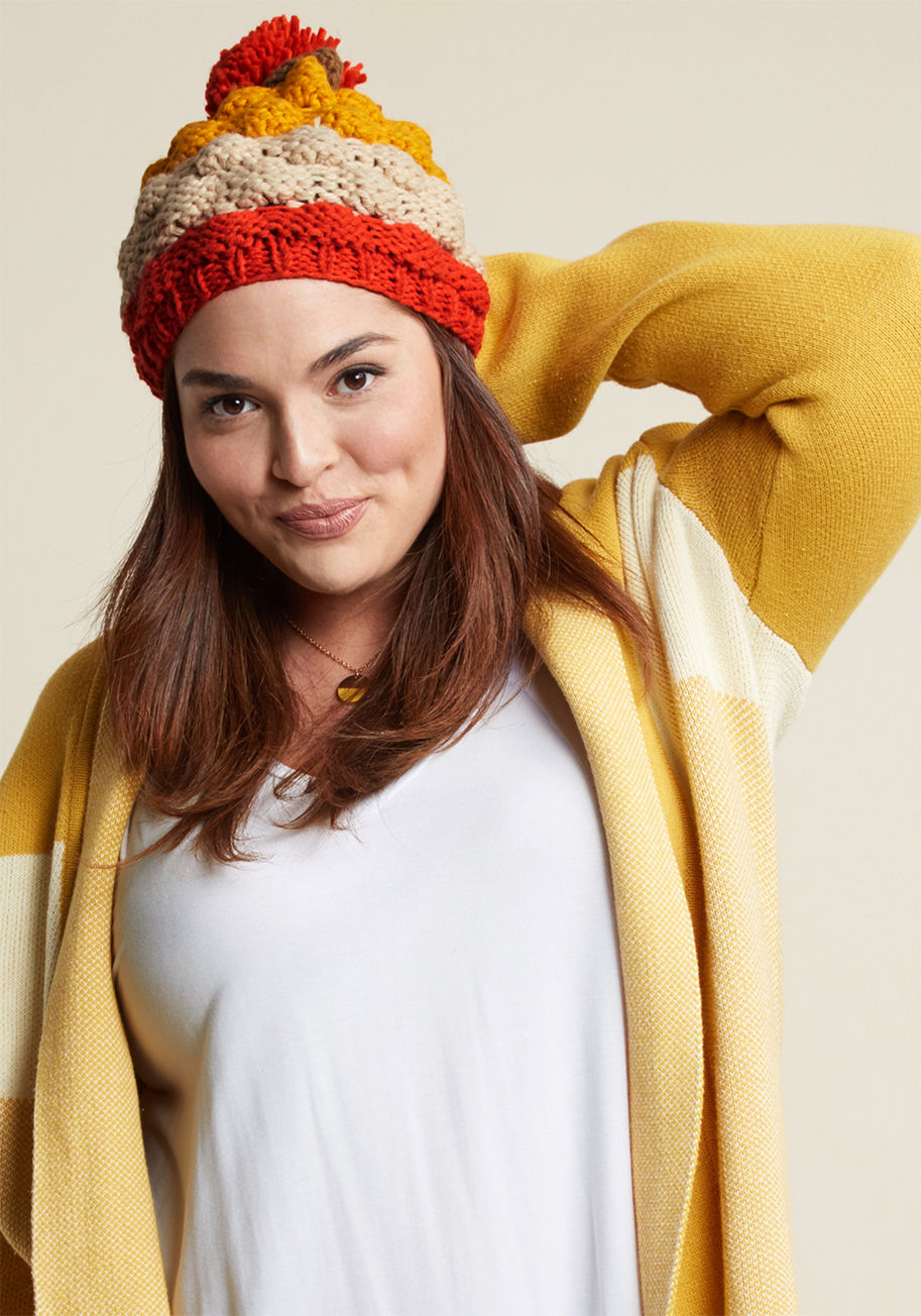  - Keep it coming with the retro accessorizin'! This textured knit beanie rocks a '70s-inspired color combo of tomato red, brown, bold marigold, and ivory, and is accented with a smile-invoking pom-pom right on top. The nostalgia here is strong - and so very