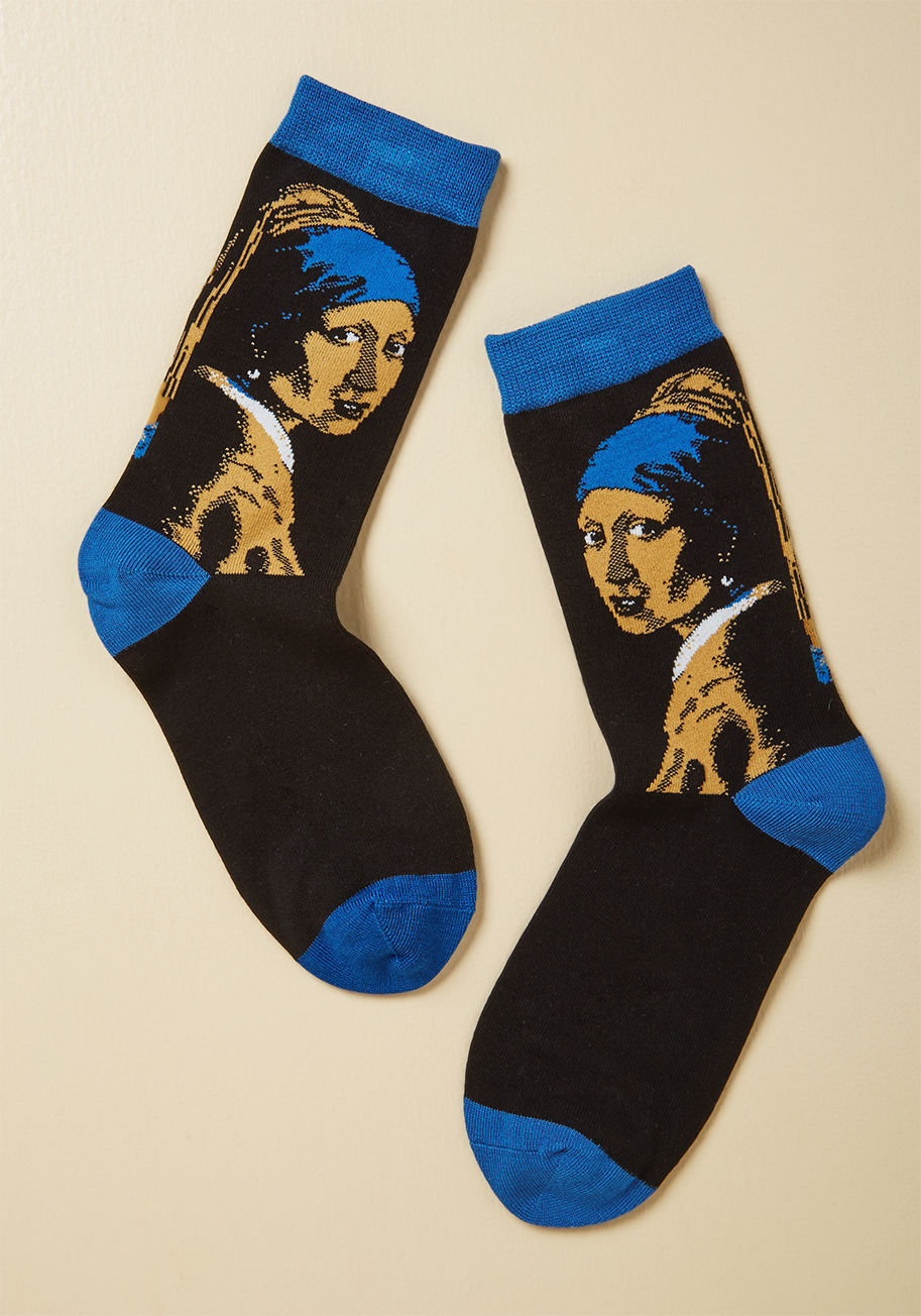  - Kick off your art collectin' with these black socks, featuring Vermeer's notable tronie, Girl With a Pearl Earring! Touting bright blue trim and a comfy knit construction, this painterly pair invites your eye for classic aesthetics into your wardrobe.