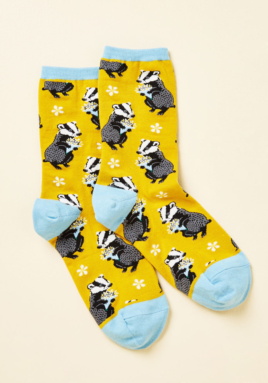  - Looks like you have a choice to make - either pass up these yellow socks, or toss 'em right into your bag! We find the latter to be the superlative option, for the bouquet-toting badgers atop this blue-capped pair makes them an absolute must-have for the 