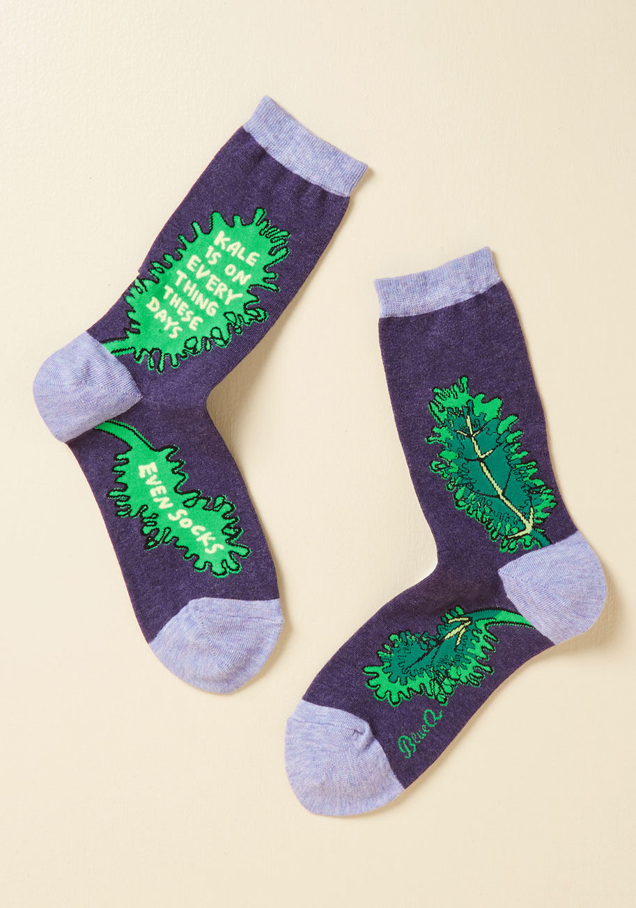  - Need to express your deliciously healthy cravings for a fun-loving look? Call upon these quirky crew socks! Featuring green leaves of everyone's favorite iron-rich veggie accompanied by a cheeky phrase, this purple pair is a wholesome ensemble observance.