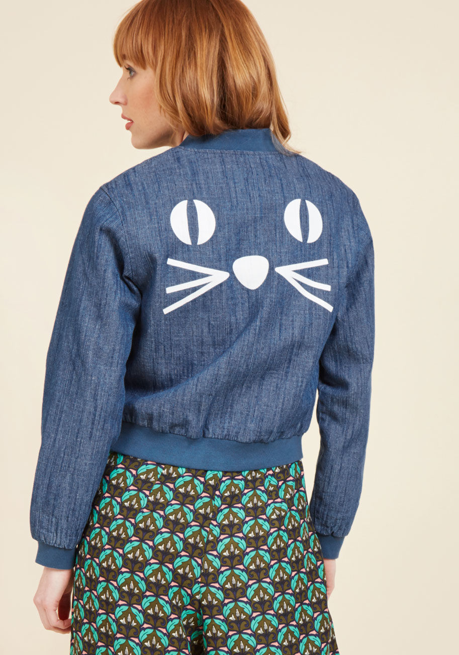 Now, we know that quirky streetwear isn't a competition, but if it was, this denim jacket by Pepaloves would definitely earn first place! That's because the ribbed collar, sleeves, and hemline, the striped lining, and the white kitty visage emblazoned upo by 