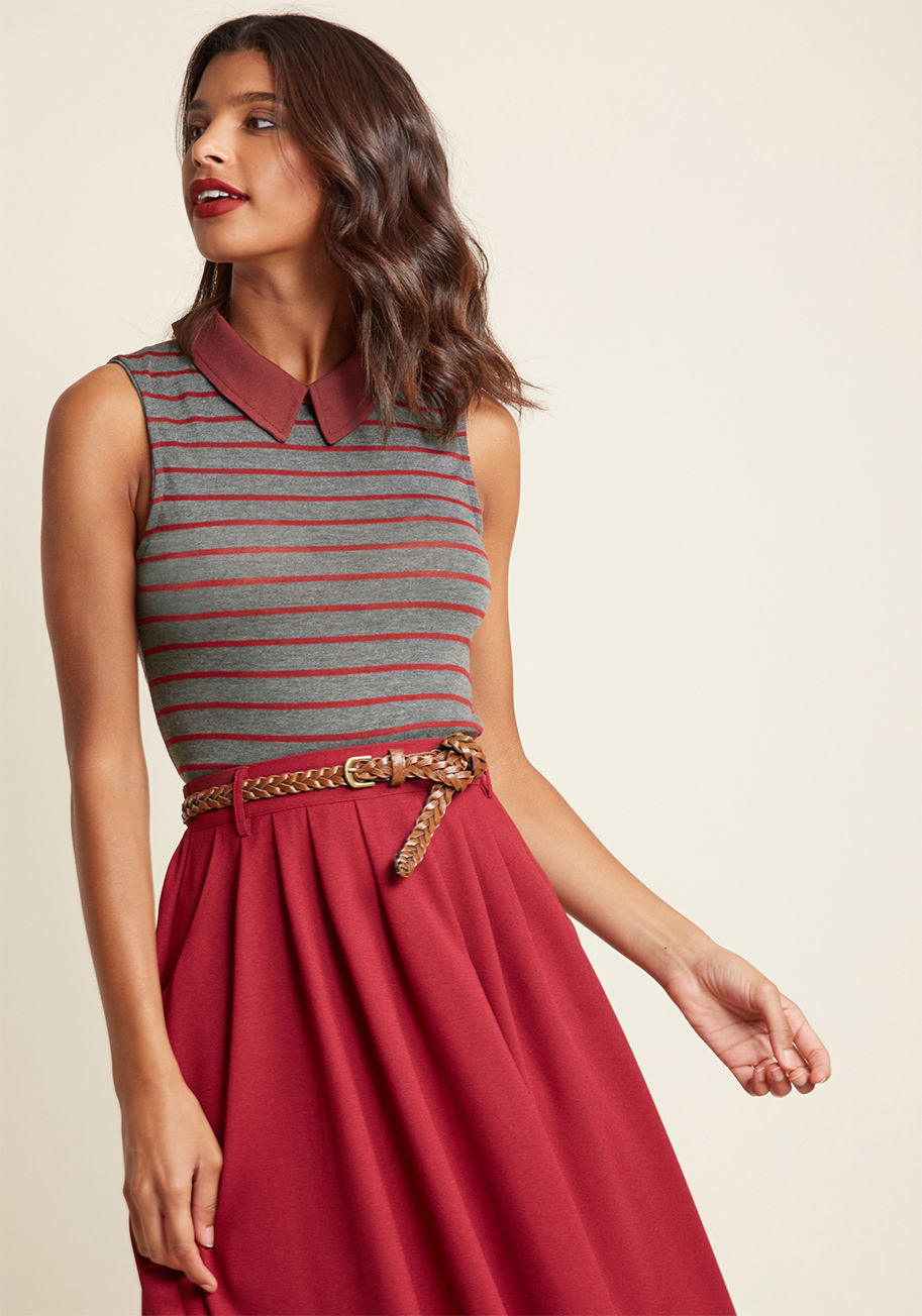  - Once you have your pals' attention, announce the ways this grey top both complements your personality and stands out from the rest of your wardrobe. First, the maroon collar - a crisp and classic touch - and next, the matching stripes and buttoned back. N