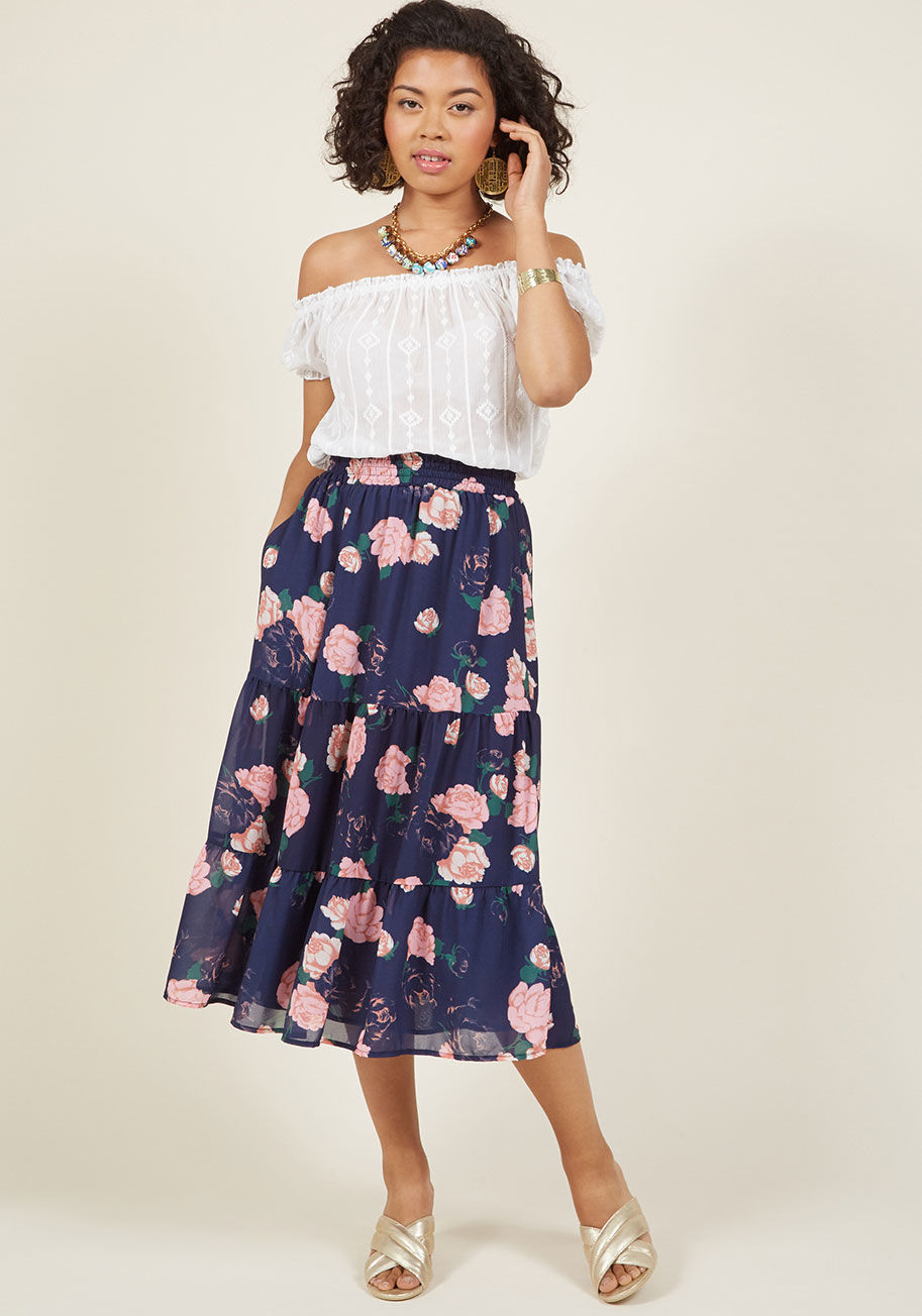  - Romance-ready and undeniably radiant, this navy blue midi skirt from our ModCloth namesake label is a dream come true. Adorable pink flowers are scattered all down the tiers of this pocketed, chiffon separate, swaying effortlessly from the elasticized wai