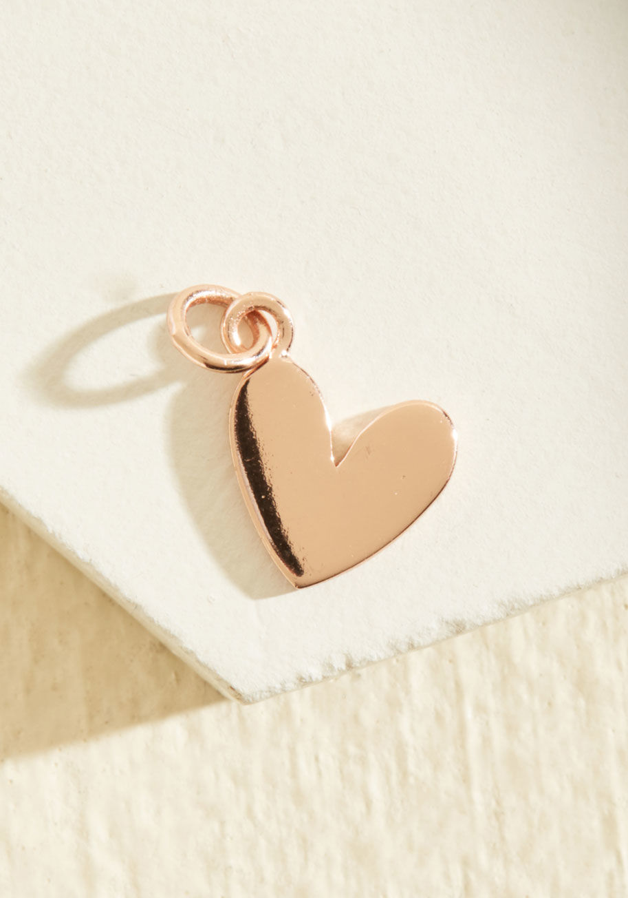  - Socialize the charms that already dangle from your bracelet with this rose gold footprint pendant! Dancing their way into your jewelry box, these little feet are the perfect stepping stone for beginning, adding to, or completing the story your charms tell