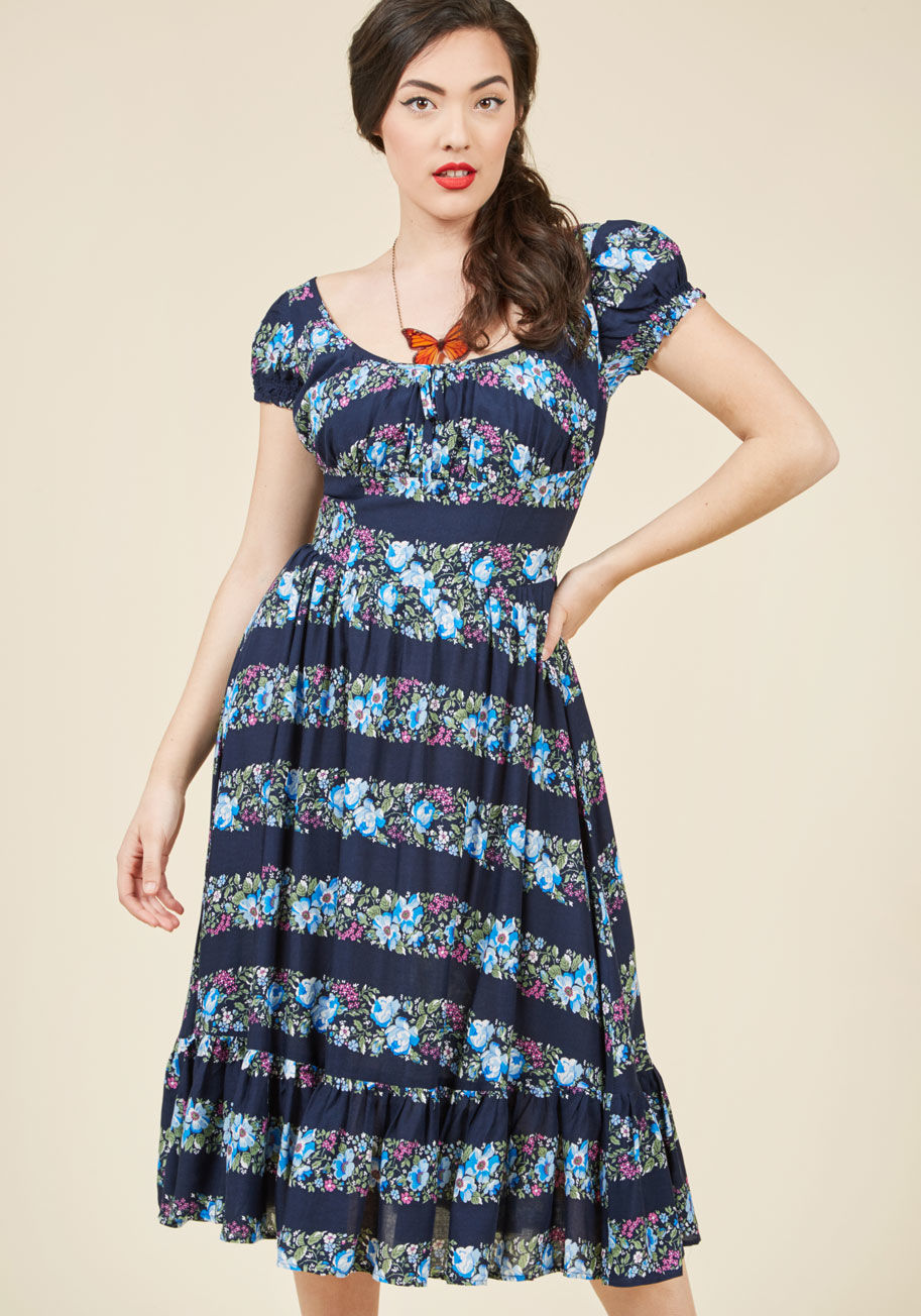  - Sure, you could stay inside with this navy skirt, but debuting its floral stripes and fun-loving design