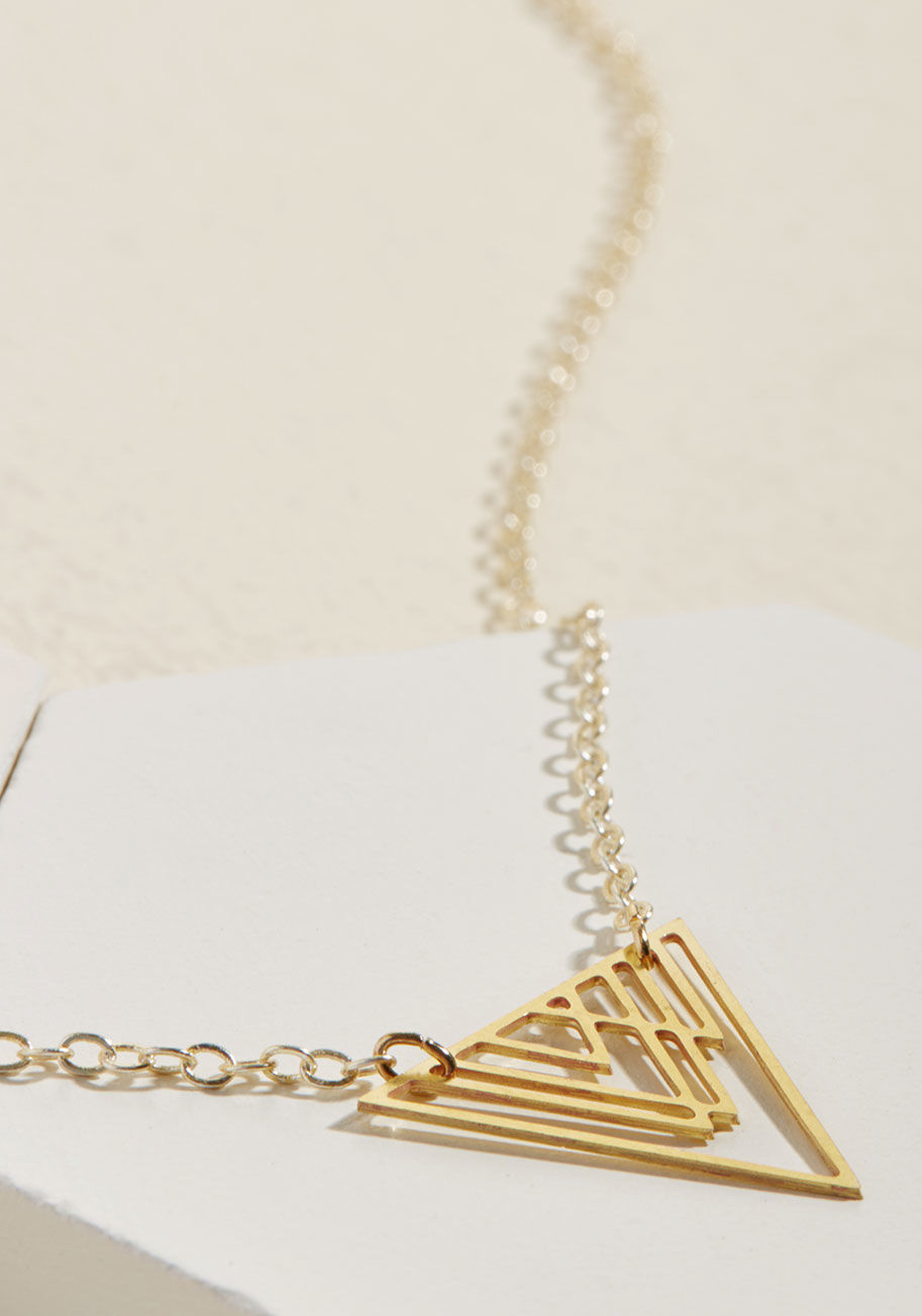  - Tall peaks and rugged ranges impress you so, and this gold necklace brings that awe to street level. A pendant of dangling triangles exudes geometric grandeur on this angular accessory, igniting inspiration