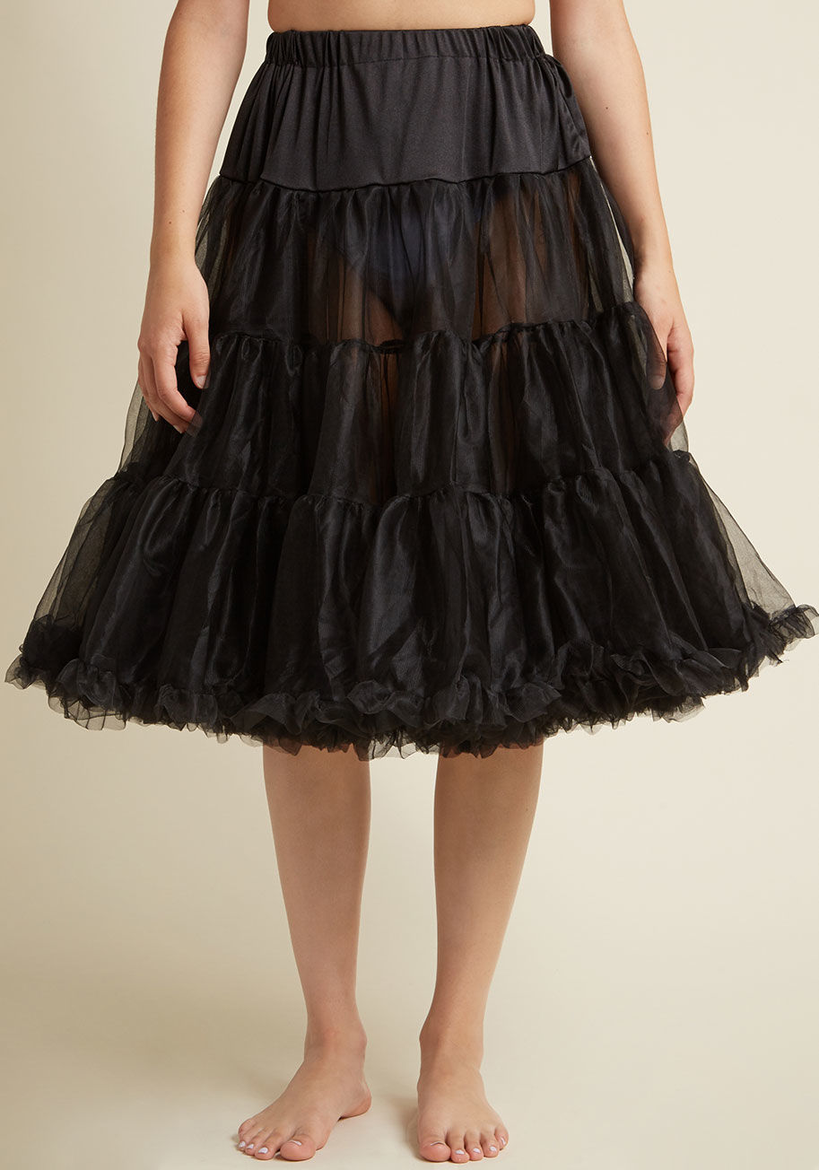  - Thanks to this classic black petticoat, your sprightly skirts and dresses bob with whimsy and vivacity. This ModCloth-exclusive petticoat features a comfortably elasticized waistband, flirty ruffles, and two full layers of tulle that are smooth to the tou