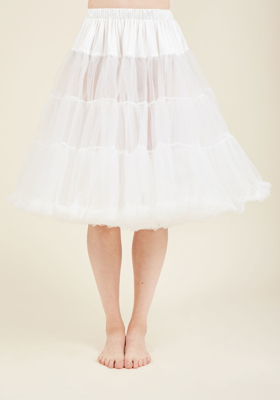  - Thanks to this classic white petticoat, your sprightly skirts and dresses bob with whimsy and vivacity. This ModCloth-exclusive petticoat features a comfortably elasticized waistband, flirty ruffles, and two full layers of tulle that are smooth to the tou