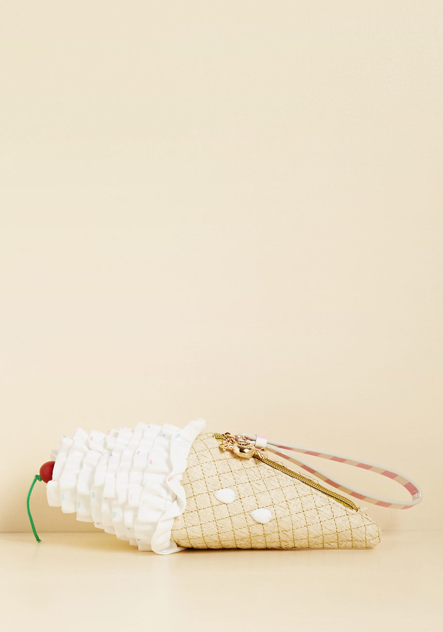  - That sweet personality and delectable style sense of yours deserves nothing less than this ice cream cone clutch from Betsey Johnson! Topped with a cherry-inspired wood bead, sprinkled