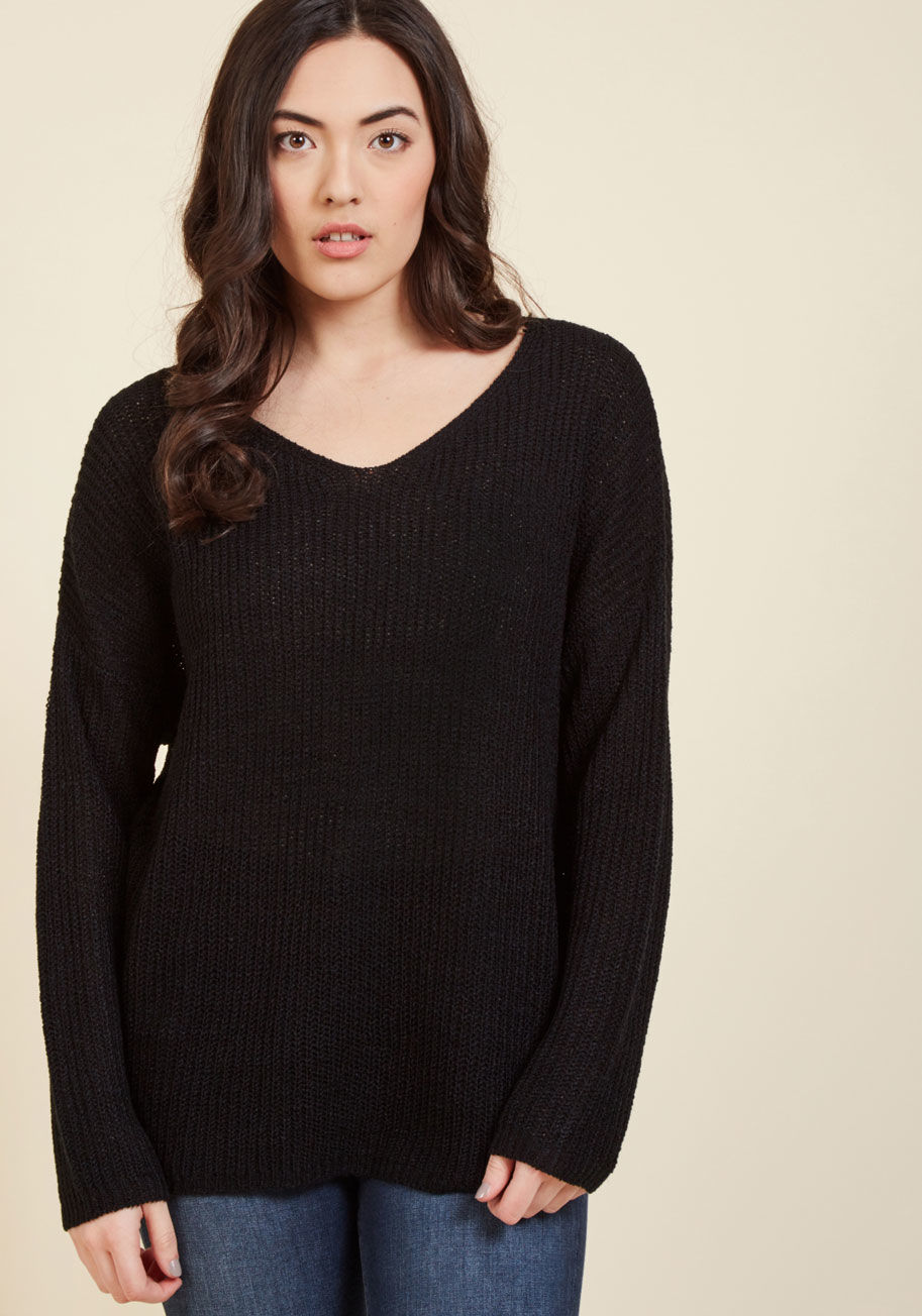  - The train ride from New York to Chicago is no quick trip, so you&rsquo;ll need this black sweater for stylish support! This pullover's loose fit and semi-sheer knit provide cozy vibes while you read, journal, and draw - hobbies that all have our vote as w