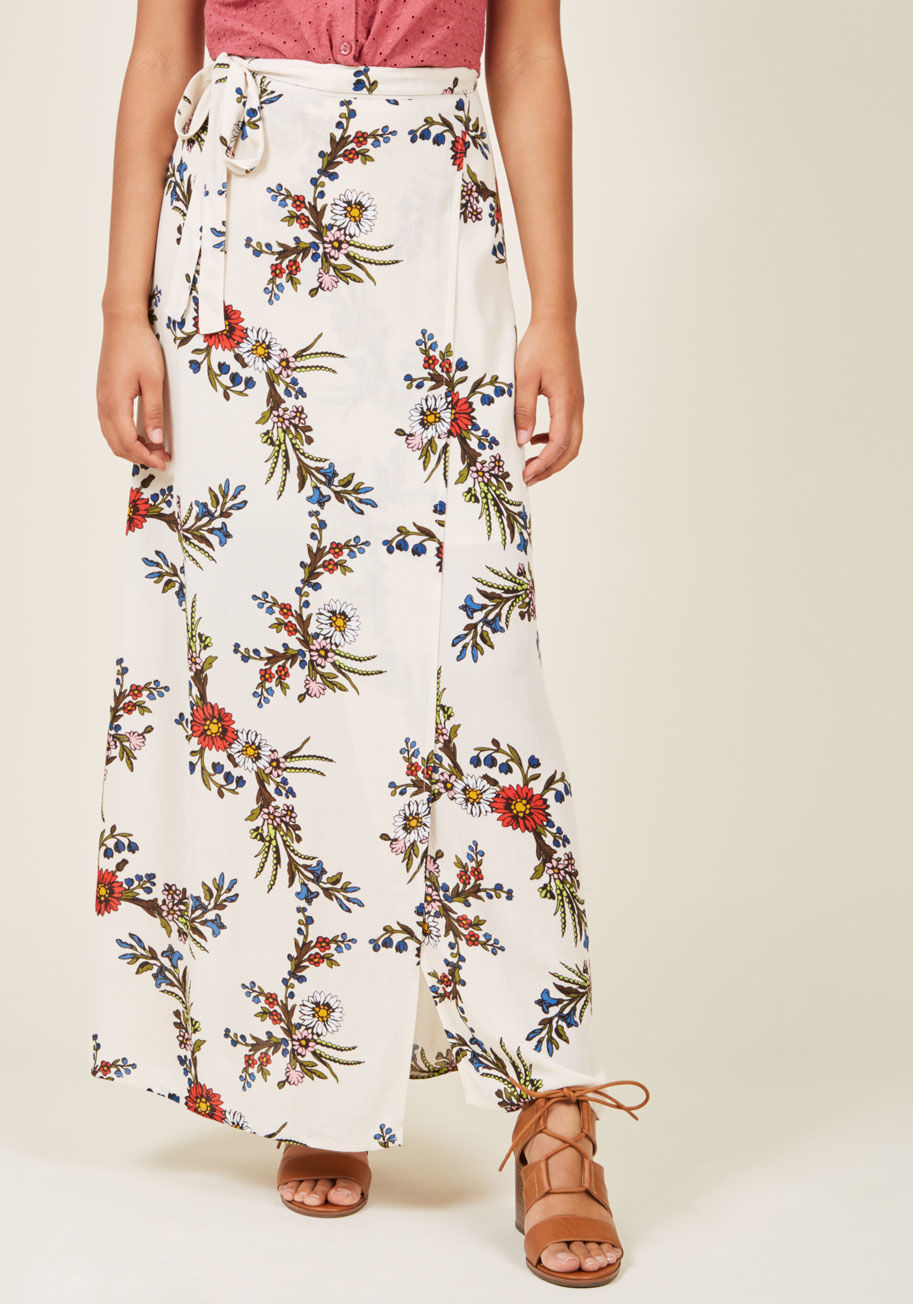  - There's no denying your adoration for throwback style - especially when it comes to all the ways you outfit this ivory maxi skirt! Brilliant, vintage-inspired flowers dazzle all over the breezy fabric of this wrap-like maxi skirt, proving that nostalgic f