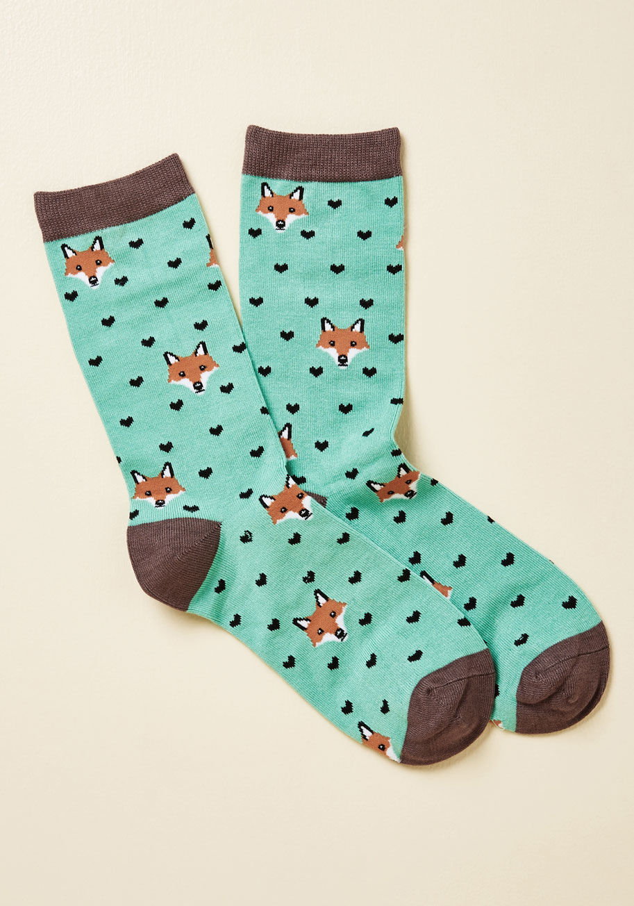  - These seafoam socks aptly combine two of the things you love most - sweet fox faces and love itself! Boasting brown trim and a black heart pattern, these cute crews complete you.