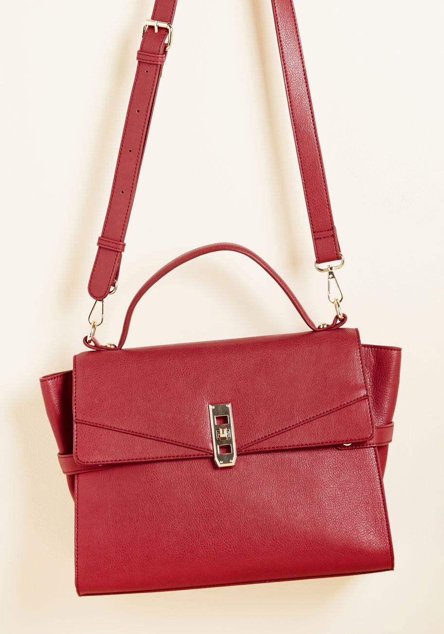  - This deep red purse isn't just a chic carry-all - it's an opportunity for everyone to relish