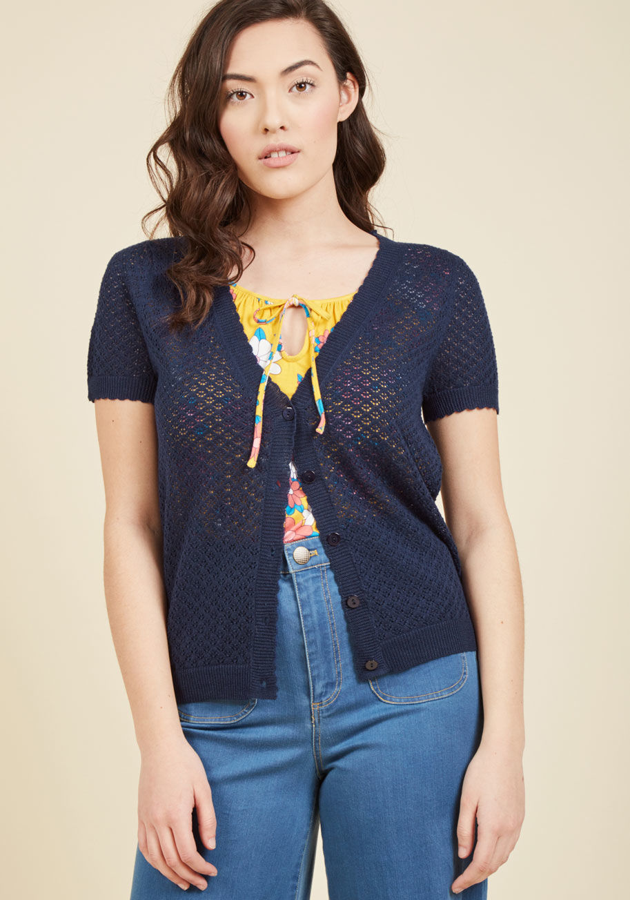  - This navy cardigan from our ModCloth namesake label bestows upon your favorite looks an instantly adorable appeal! Delicate scallops around the neckline, short sleeves, placket, and hem frame the darling picot stitching of this button-front layering piece