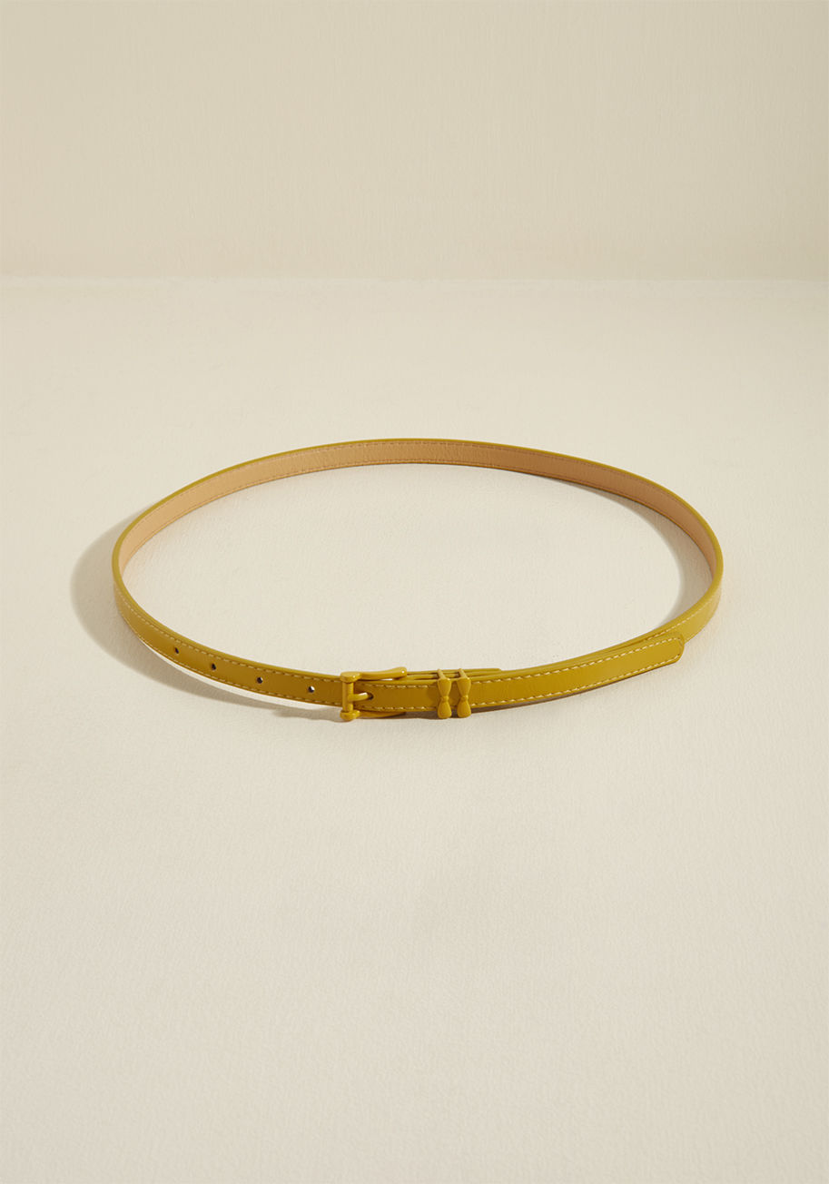  - This simple, slim belt by Banned has a way of taking ensembles from that'll do to holy wow! How so? Well, the rich yellow hue, matching buckle, and subtle double-bow loops of this faux-leather accessory are all thoughtful details that give your look a wel