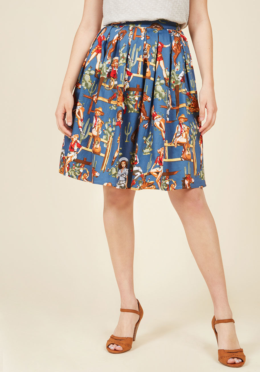  - This stretch-cotton midi skirt is the best of the 'west'! Boasting pockets, pleats, and pin-up cowgirls printed all over a bold blue backdrop, this ModCloth-exclusive bottom is one style