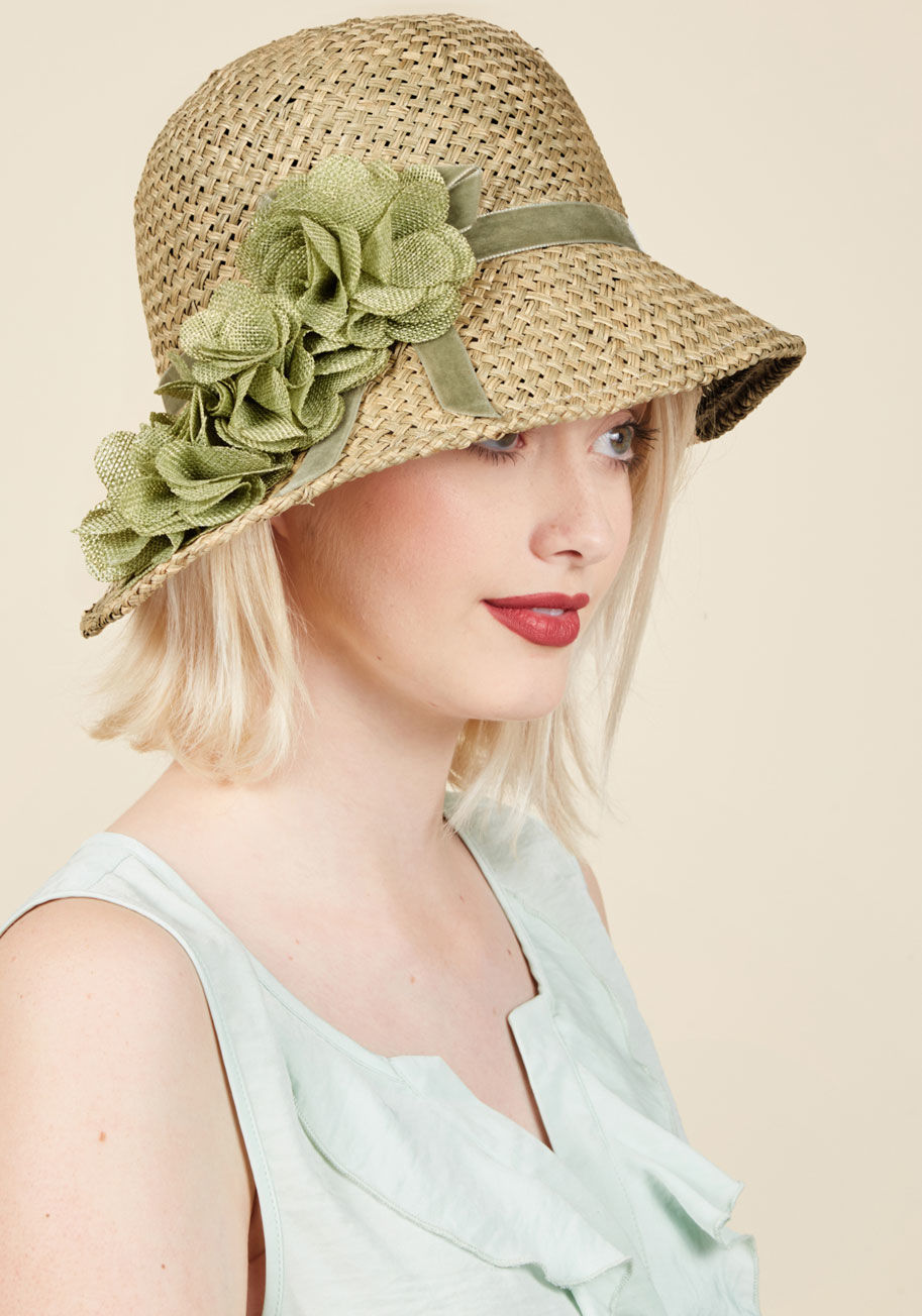  - This vintage-inspired cloche is effortlessly elegant! Its unique, asymmetrical design of woven straw hearkens to the days of letter-writing