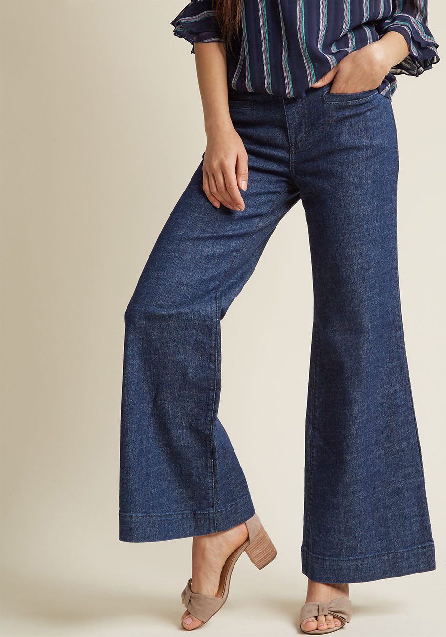  - To say denim is a style tradition is an understatement - it's your M.O.! These dark wash jeans were created as a part of our ModCloth-exclusive collaboration with Wrangler to feature front slit pockets, light blue stitching on their back pockets, and a wo