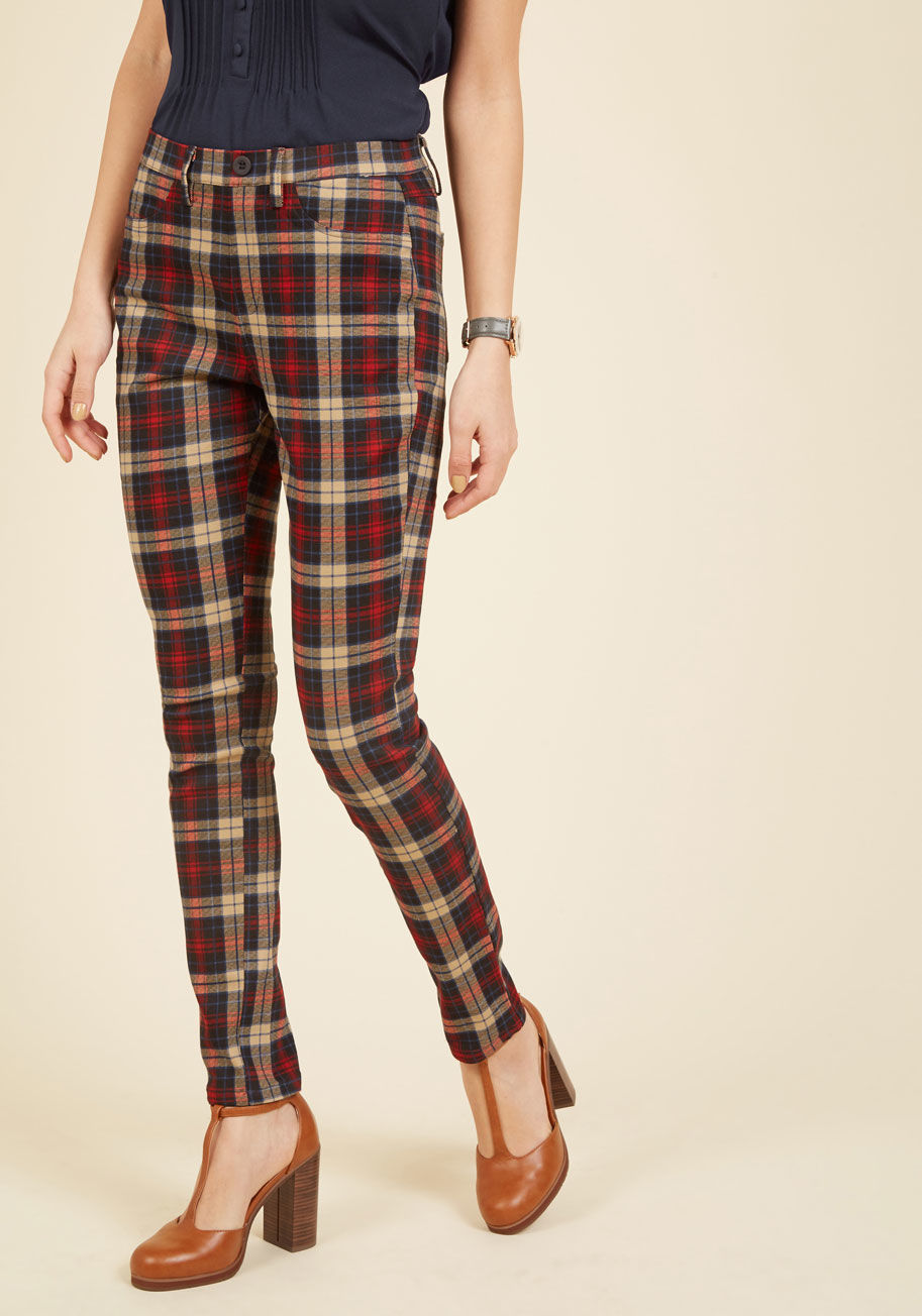  - Wanna talk about a style score? Then let&rsquo;s discuss these standout stretch skinnies! Take your time admiring the black, tan, and green plaid print on this decoratively buttoned and faux-front-pocketed pair - that is, after slipping their pull-on silh