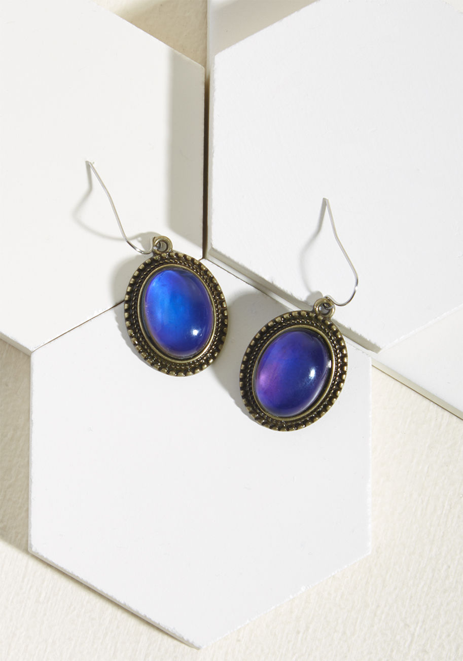  - Well, the second you don these dangling earrings, you will be! Starring dark, iridescent faux-moonstones - primed to change color with your mood - this antiqued gold pair casts a bewitching air, completing your stellar looks with spell-binding finesse.