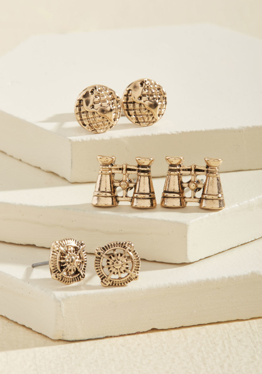  - Whether it's a quick trip to the grocery store or a trek across the earth, your adventurous spirit is always on display with these gold studs! A collection exclusive to ModCloth, these earrings - shaped as binoculars, globes, and compasses - are the perfe