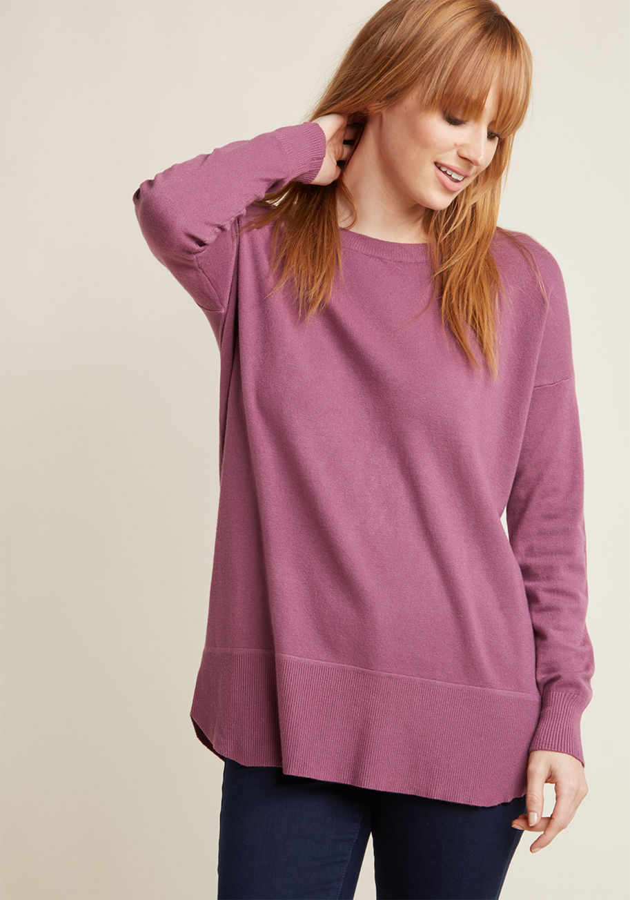  - Your challenge? Create a look that's comfy, cuddly, and downright cozy. The solution? This purple pullover, obviously! Lightweight knit fabric and an inviting, oversized fit make this sweater an optimal layering piece, so consider the obstacle of crafting