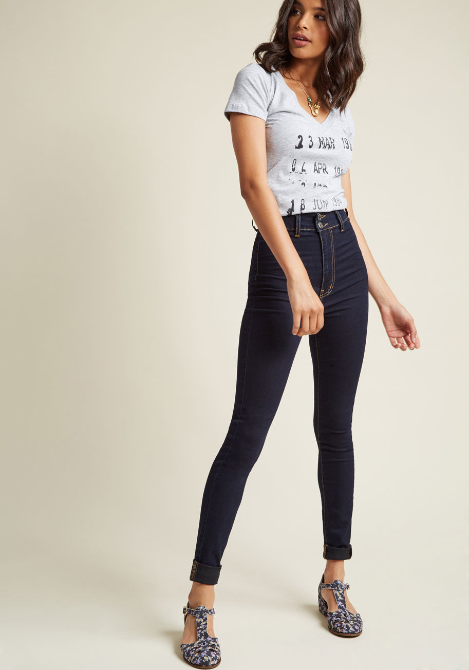  - Your style has always centered around on-trend and simple staples like these high-waisted jeans, which you rock at the roller rink today. Featuring two back pockets and a form-fitting stretch silhouette, these dark-wash skinnies are a sleek testament to y