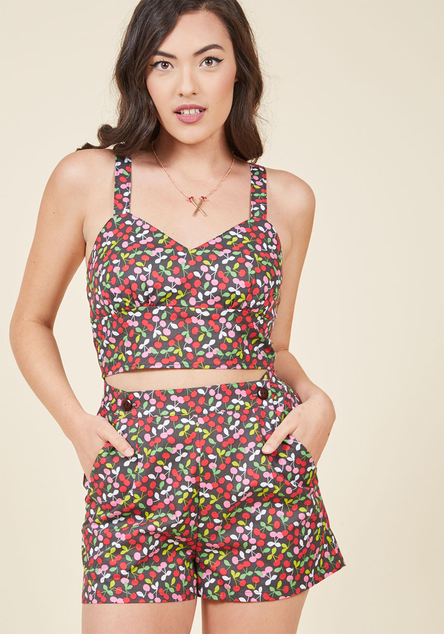  - Your sweet styling sense and these cotton shorts - what a sartorial dream team! A button-topped high waist and pockets collaborate with this retro wonder's refreshing print of red, pink, and white cherries, making for a look that's a blast to pair with ma