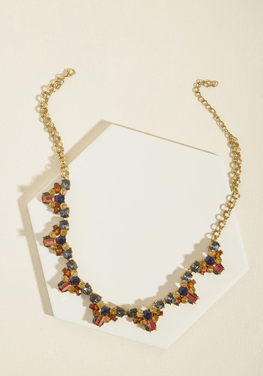  - Your usual fancy looks involve simple lines and classy accents. But, now that you have this statement necklace to express yourself, it's bold color and brilliant sparkle! Clasped behind your neck by an adjustable gold chain and radiating uniqueness with i