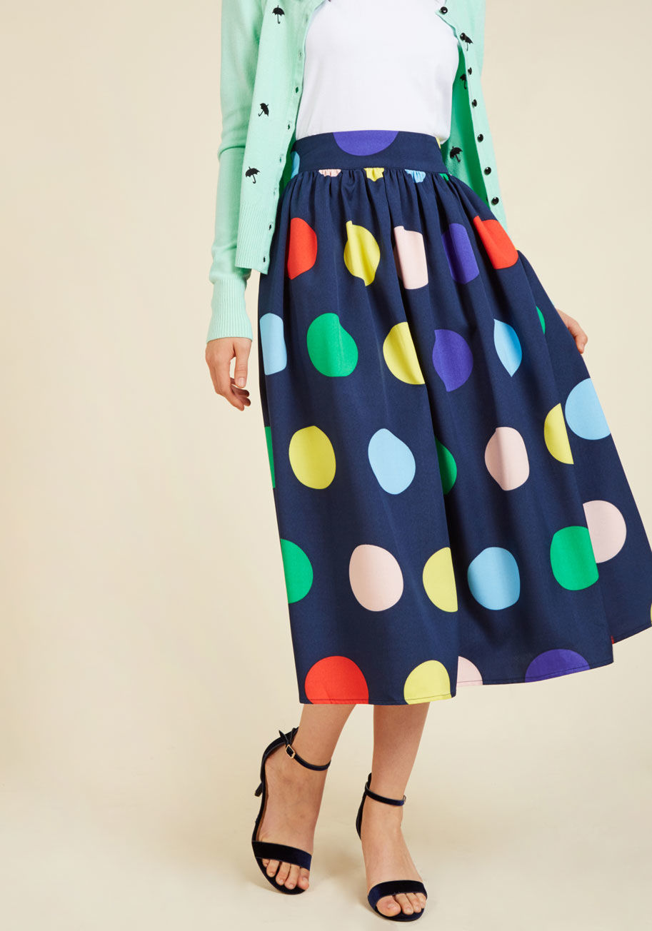  - You're certain to make a gal pal date totally stylish by donning this navy blue skirt for an afternoon of noshing noodles and nattering! With a gathered waist and a fun print of large, multicolored polka dots, this midi displays just as much good taste as