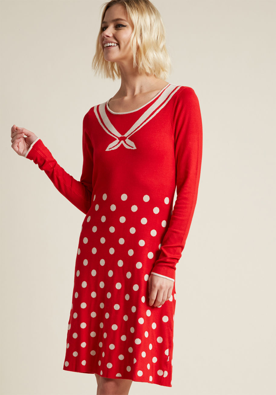 001173-361 - Bring the thrill of the open ocean home with this red sweater dress from hard-to-find German brand, Blutsgeschwister. Decorated with a trompe l'oeil ascot, a dotted skirt, and white-piped long sleeves, this knit sheath masters feminine and nostalgic detai